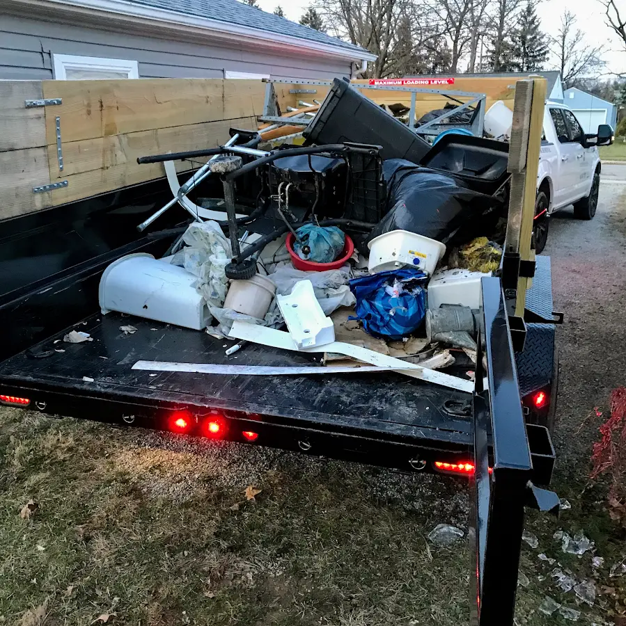 Roll-off dumpster delivered to a residential driveway in Manhattan